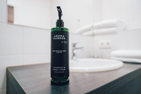 Shower, eco-friendly toiletries, hair dryer, towels