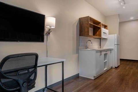 Premium bedding, desk, laptop workspace, iron/ironing board