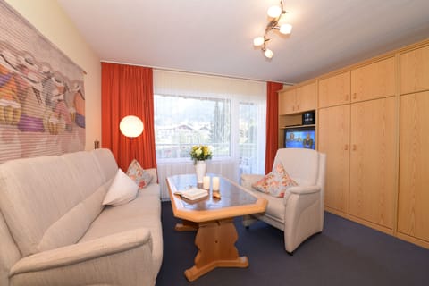 Family Apartment, Balcony (Standard) | Living area | 20-inch flat-screen TV with satellite channels, TV, foosball