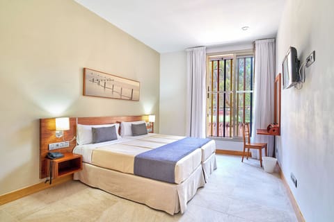 Double Room, Accessible | Minibar, desk, blackout drapes, iron/ironing board
