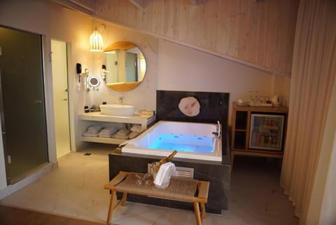 Executive Suite, Jetted Tub (Mediterranean) | Bathroom | Rainfall showerhead, designer toiletries, hair dryer, slippers