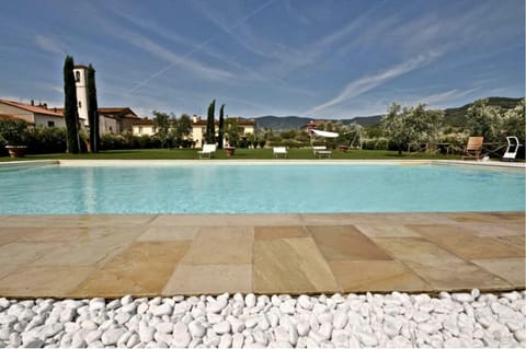 Seasonal outdoor pool, open 9:00 AM to 6:00 PM, pool umbrellas