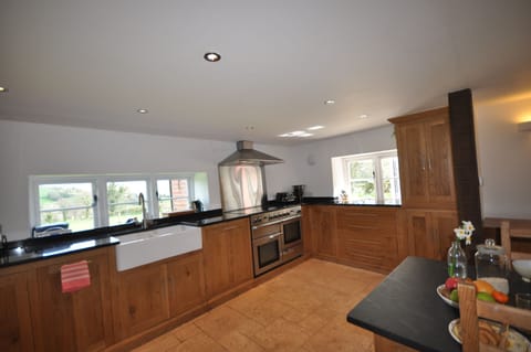 Cottage | Private kitchen | Stovetop, dishwasher, highchair, cookware/dishes/utensils