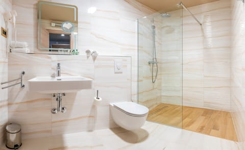 Designer toiletries, hair dryer, bathrobes, slippers