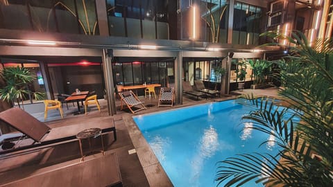 Outdoor pool, open 8:00 AM to 10:00 PM, sun loungers