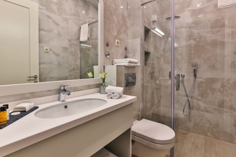 Shower, hair dryer, slippers, towels