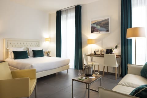 Executive Triple Room | Minibar, in-room safe, desk, blackout drapes