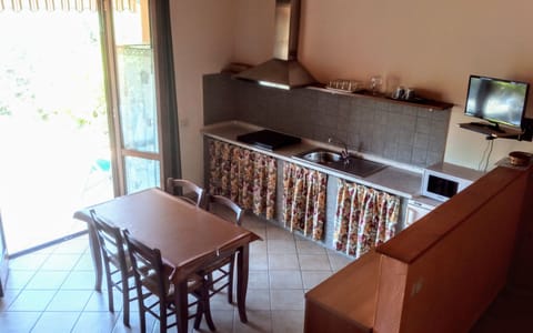 Fridge, microwave, stovetop, cookware/dishes/utensils