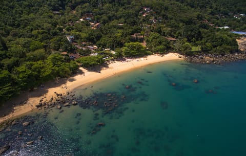 Beach nearby, white sand, beach umbrellas, beach towels