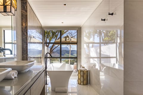 Suite (Africa) | Bathroom | Separate tub and shower, free toiletries, bathrobes, slippers