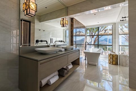 Suite (Africa) | Bathroom | Separate tub and shower, free toiletries, bathrobes, slippers