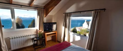 Premium Quadruple Room | Minibar, in-room safe, desk, laptop workspace