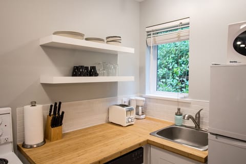 Studio A Cottage | Private kitchen | Full-size fridge, microwave, stovetop, dishwasher