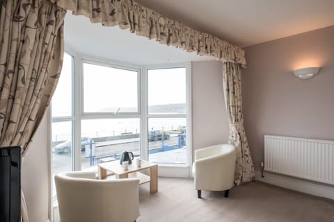 Honeymoon Suite, Sea View | Living area | Flat-screen TV