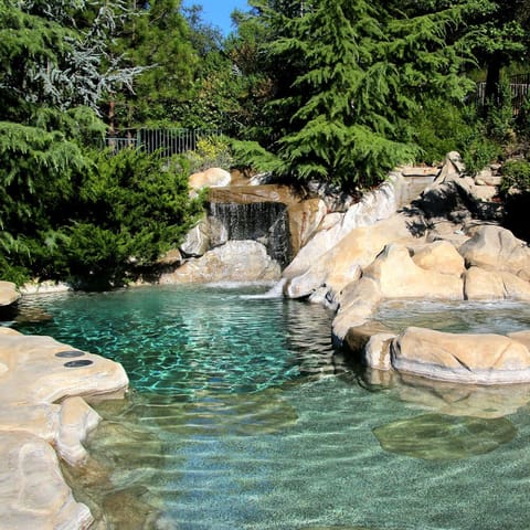 Seasonal outdoor pool, open 8:00 AM to 10:00 PM, pool umbrellas