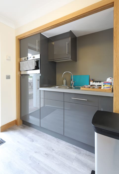 Full-size fridge, microwave, electric kettle, cookware/dishes/utensils