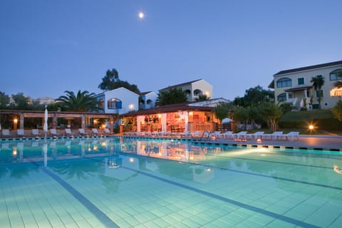 Seasonal outdoor pool, open 10:00 AM to 6:00 PM, pool umbrellas