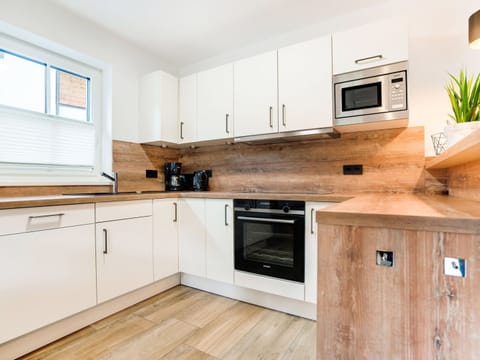 Chalet | Private kitchen | Fridge, highchair