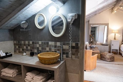 Deluxe Suite, Balcony - Attic (Adiandi Building, 3rd floor, stair access only) | Bathroom | Shower, hair dryer, slippers, towels