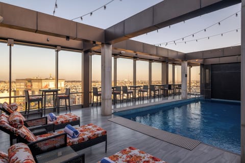 Seasonal outdoor pool, open 7:00 AM to 7:00 PM, sun loungers