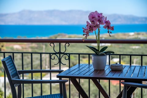 Deluxe Room, Sea View | Free minibar, in-room safe, desk, laptop workspace