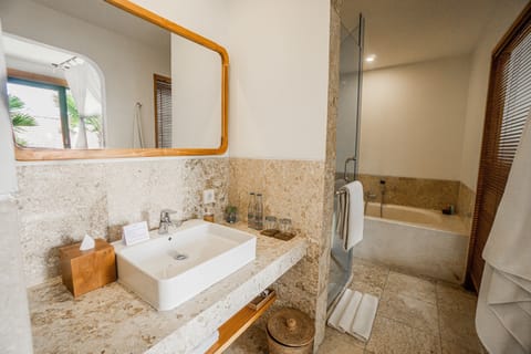 Separate tub and shower, rainfall showerhead, free toiletries