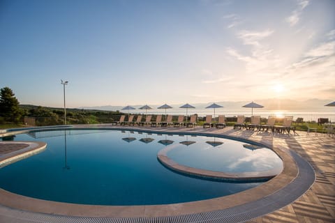 Outdoor pool, open 8:30 AM to 8:30 PM, pool umbrellas, sun loungers