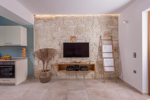 Junior Suite, Sea View | Living area | 50-inch flat-screen TV with cable channels, TV