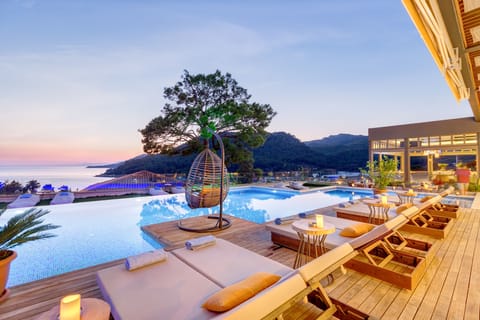 Outdoor pool, open 10:00 AM to 11:00 PM, pool umbrellas, sun loungers
