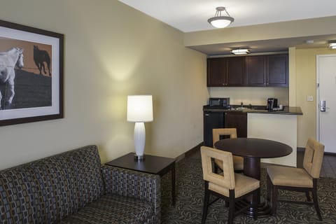 Suite, 1 King Bed | Desk, laptop workspace, blackout drapes, iron/ironing board