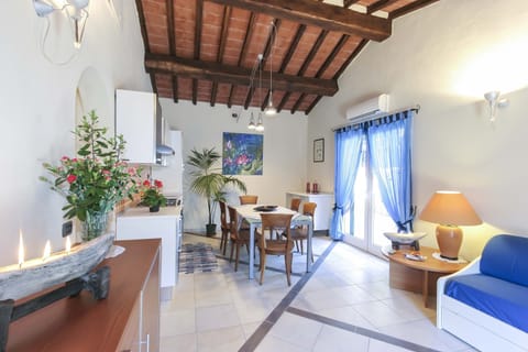 Apartment, 2 Bedrooms (VILLETTA NASSI) | Living area | Flat-screen TV