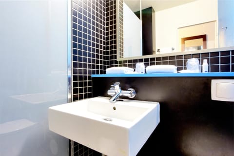 Shower, eco-friendly toiletries, hair dryer, towels