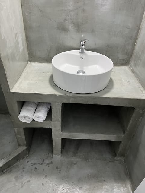 Shower, hair dryer, slippers, towels