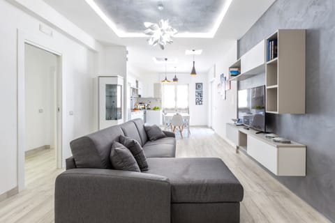 Apartment, 2 Bedrooms | Living area | Flat-screen TV, books, pay movies