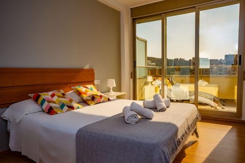 Apartment, 2 Bedrooms, Sea View | 2 bedrooms, blackout drapes, iron/ironing board, travel crib