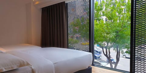 Elite Quadruple Room | Down comforters, blackout drapes, free WiFi, bed sheets