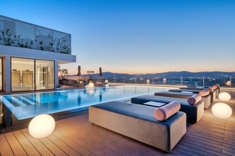 Outdoor pool, a heated pool, open 9:00 AM to 8:00 PM, pool umbrellas