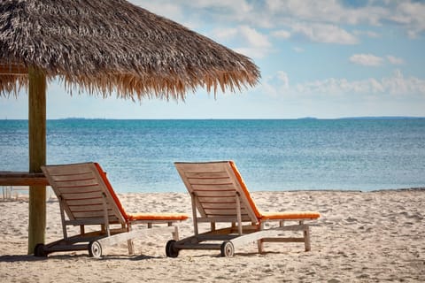 Private beach, white sand, free beach cabanas, sun loungers