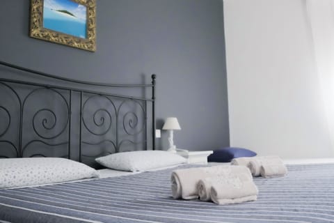 Deluxe Quadruple Room, Private Bathroom (Grey - 4 Pax) | Premium bedding, down comforters, memory foam beds, iron/ironing board