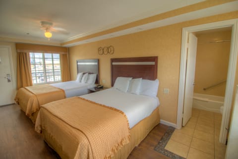 Standard Room, 2 Queen Beds, Non Smoking, Refrigerator & Microwave | Pillowtop beds, desk, laptop workspace, blackout drapes