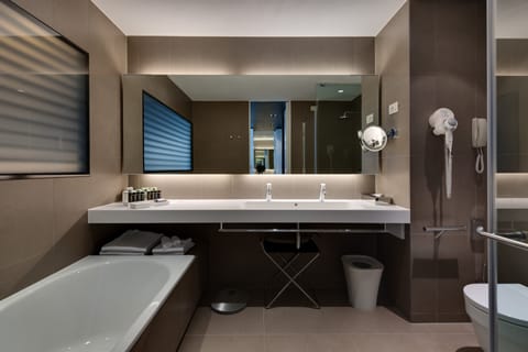 Separate tub and shower, rainfall showerhead, designer toiletries