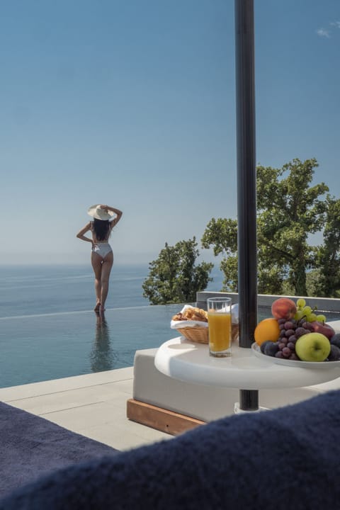 Seasonal outdoor pool, open 9:00 AM to 6:00 PM, pool umbrellas