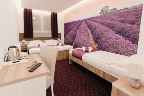 Superior Triple Room | Minibar, in-room safe, individually decorated, individually furnished