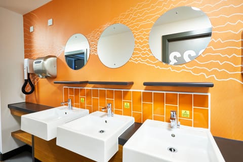 Shower, hair dryer, soap, toilet paper