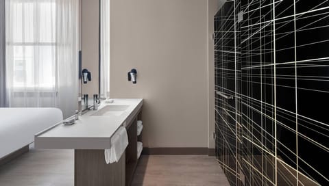 Room, 1 King Bed (Metro) | Bathroom | Shower, rainfall showerhead, free toiletries, hair dryer