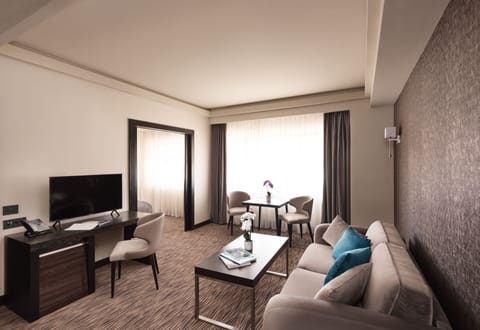 Superior Suite, City View | Living area | 105-cm Smart TV with satellite channels, TV