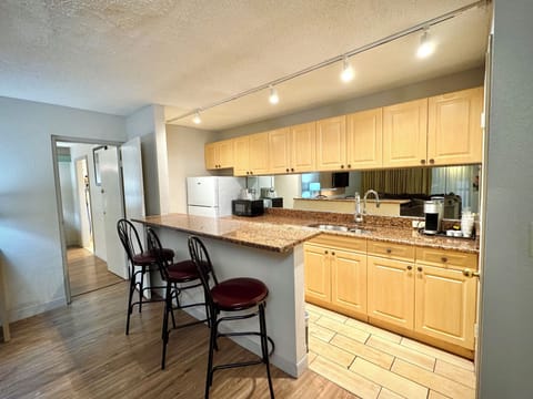 Suite, Non Smoking (1 King and 2 Double Beds) | Private kitchenette | Fridge, microwave, coffee/tea maker