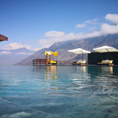 Outdoor pool, pool umbrellas, sun loungers