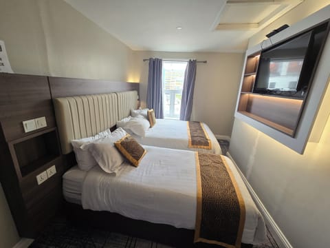 Pillowtop beds, desk, free WiFi, bed sheets