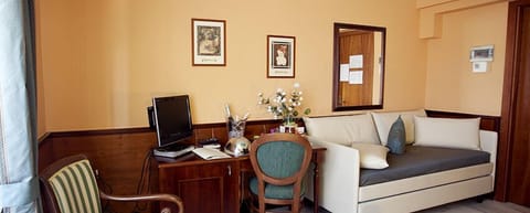 Economy Double or Twin Room | Living area | TV